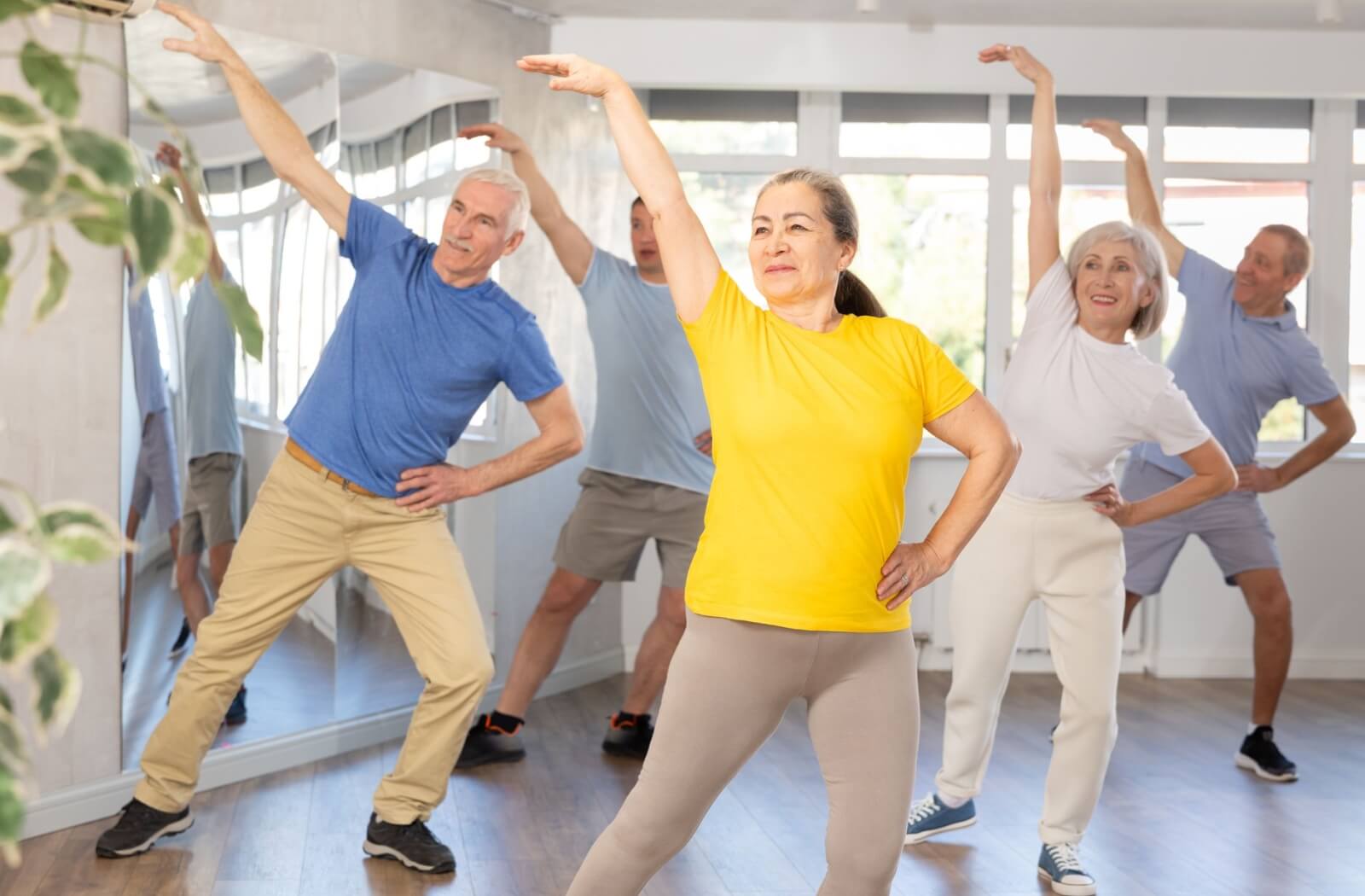 A group of older adults in an exercise class.